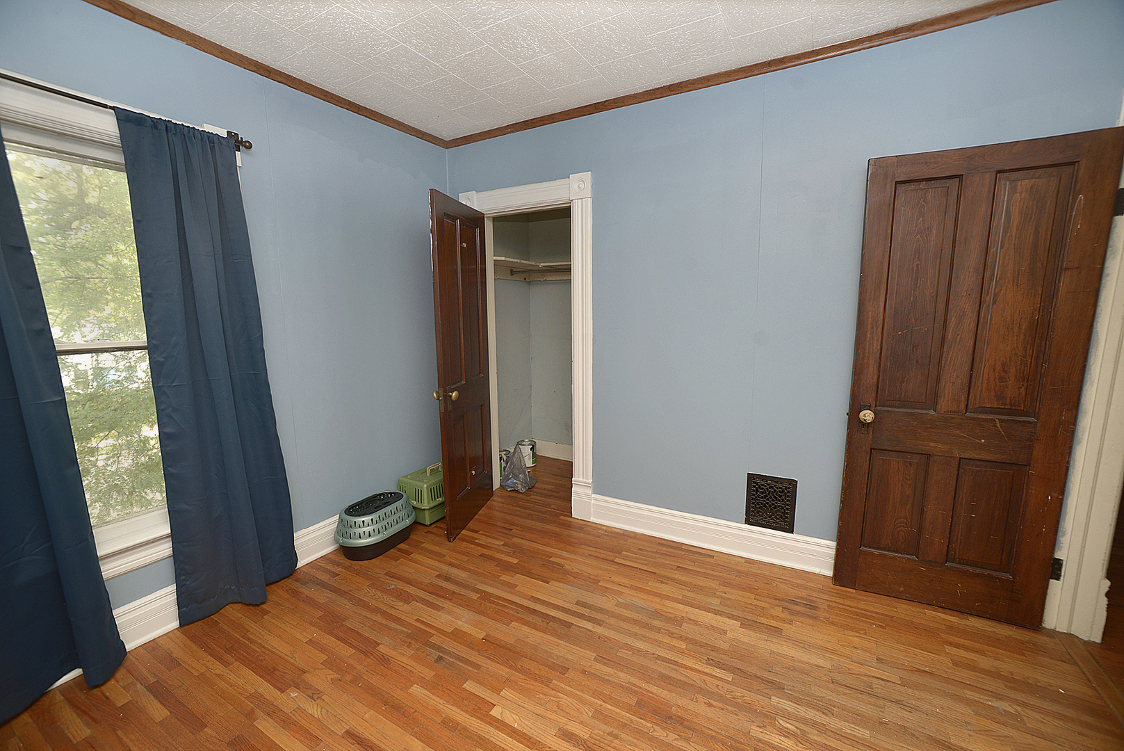 1050 State Street Ottawa, IL 61350 - Photo 11 of 25 a bedroom with a bed and wooden floor