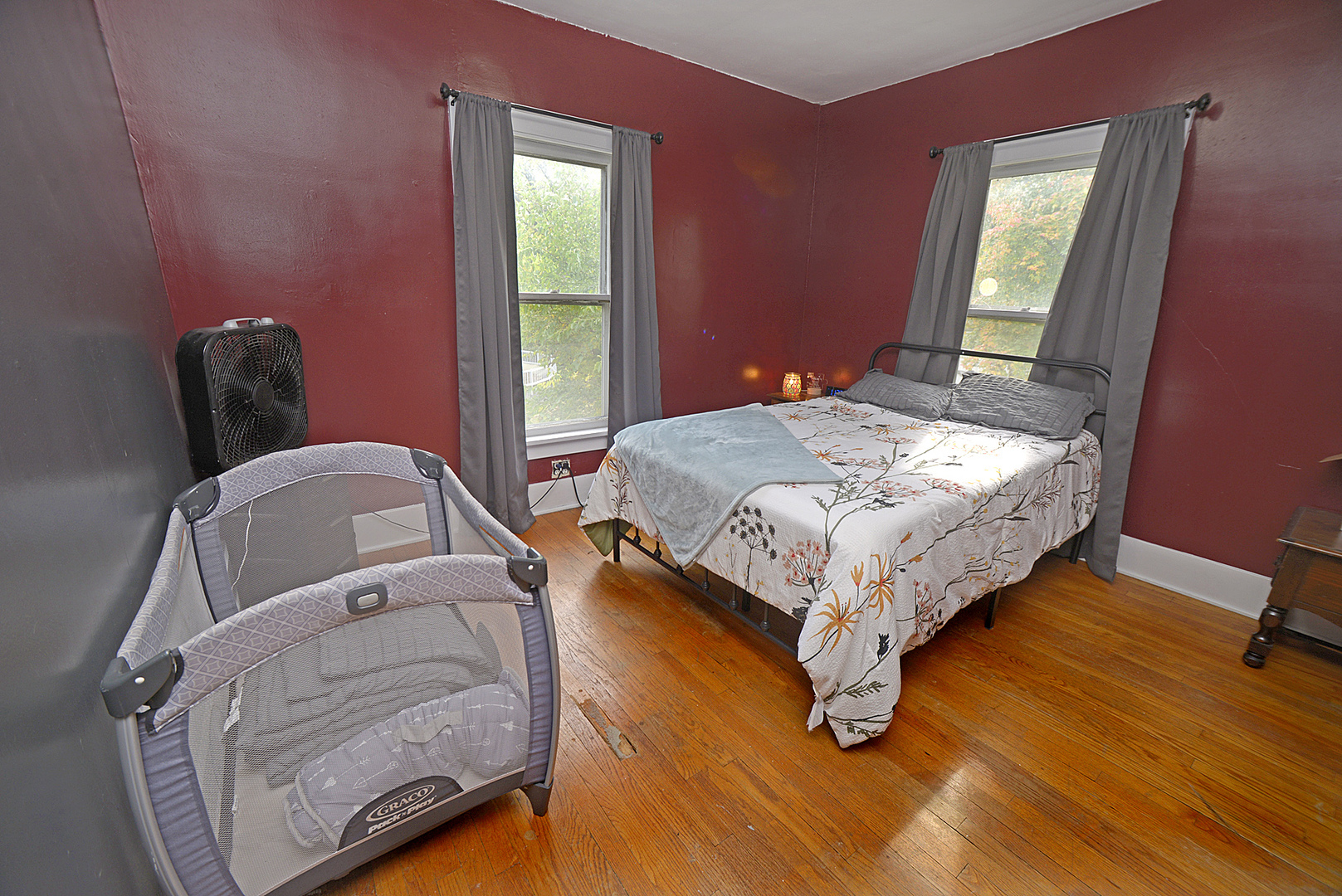 1050 State Street Ottawa, IL 61350 - Photo 15 of 25 a bedroom with a bed and wooden floor