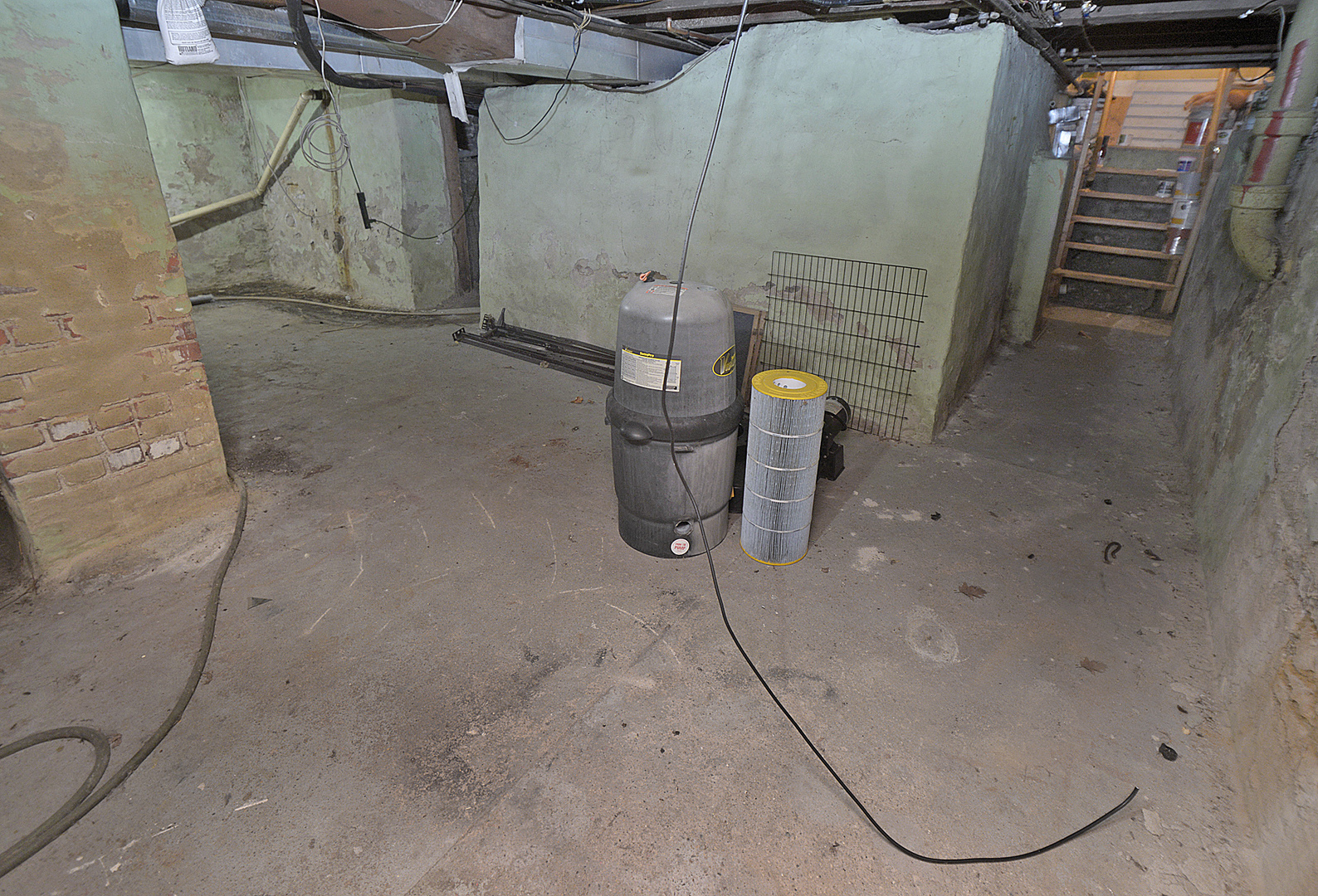 1050 State Street Ottawa, IL 61350 - Photo 25 of 25 a view of a room with water heater and racks on the wall