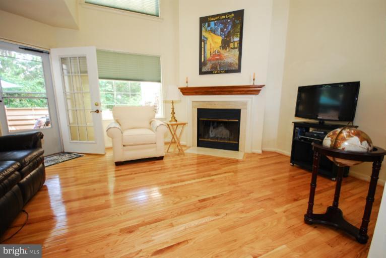 1503 Deer Point Way Reston, VA 20194 - Photo 2 of 21 a living room with furniture and a flat screen tv