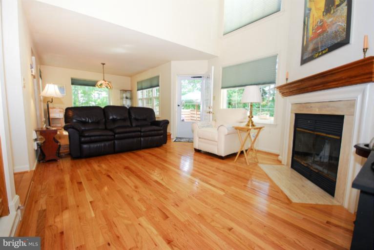 1503 Deer Point Way Reston, VA 20194 - Photo 13 of 21 a living room with furniture and a fireplace