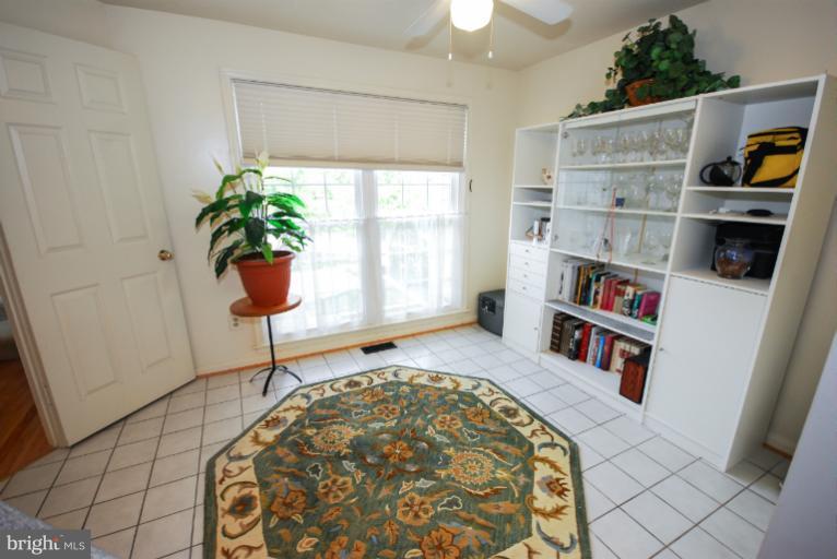 1503 Deer Point Way Reston, VA 20194 - Photo 15 of 21 a bedroom with furniture and a book shelf