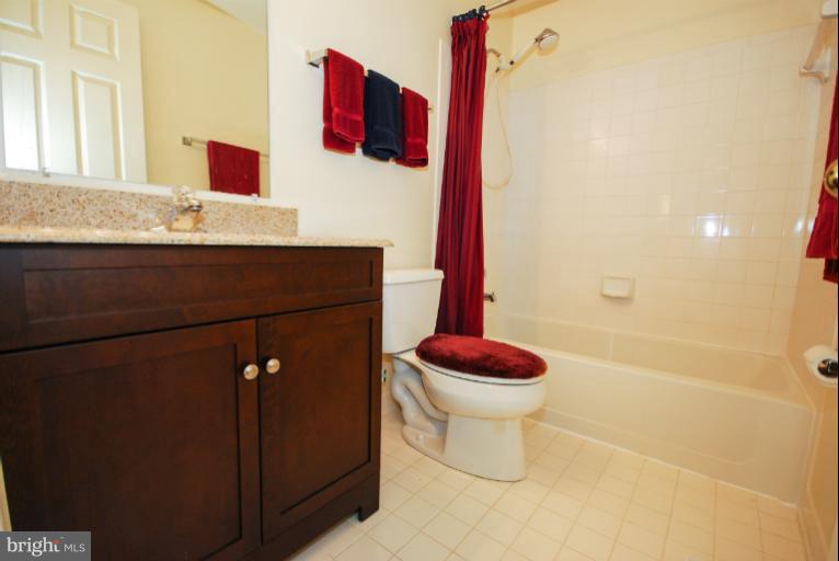 1503 Deer Point Way Reston, VA 20194 - Photo 16 of 21 a bathroom with a granite countertop sink and a mirror