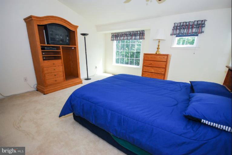 1503 Deer Point Way Reston, VA 20194 - Photo 17 of 21 a bedroom with a bed and a window