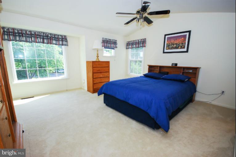 1503 Deer Point Way Reston, VA 20194 - Photo 4 of 21 a bedroom with a bed and a desk