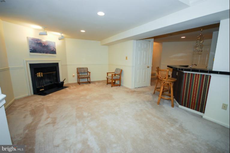 1503 Deer Point Way Reston, VA 20194 - Photo 7 of 21 a view of livingroom with furniture and a fireplace