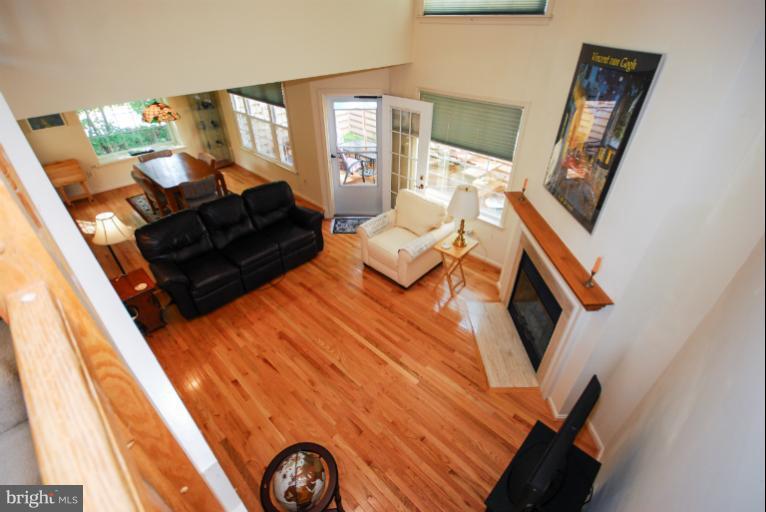 1503 Deer Point Way Reston, VA 20194 - Photo 10 of 21 a living room with furniture and a fireplace