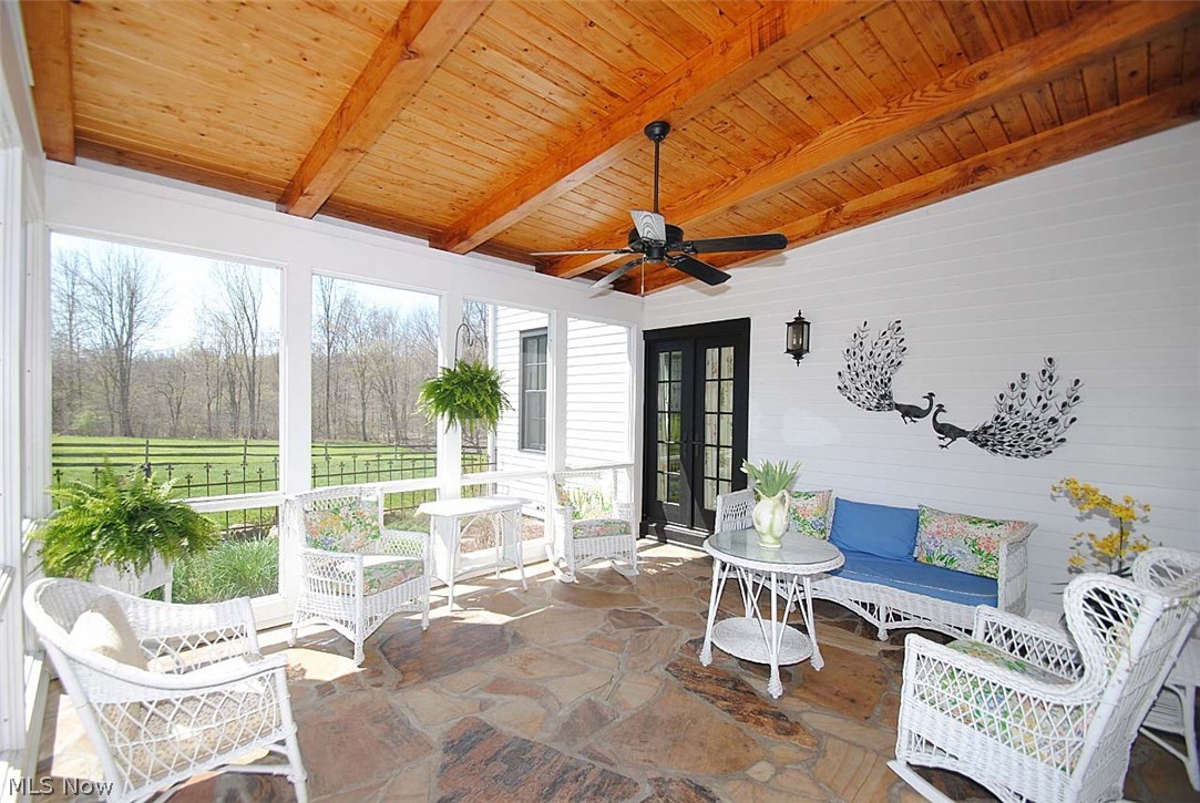 9923 Fairmount Road Newbury, OH 44065 - Photo 4 of 35 BRIGHT AND SUNNY REAR SCREENED PORCH WITH STONE FLOORING AND GORGEOUS CEILING!