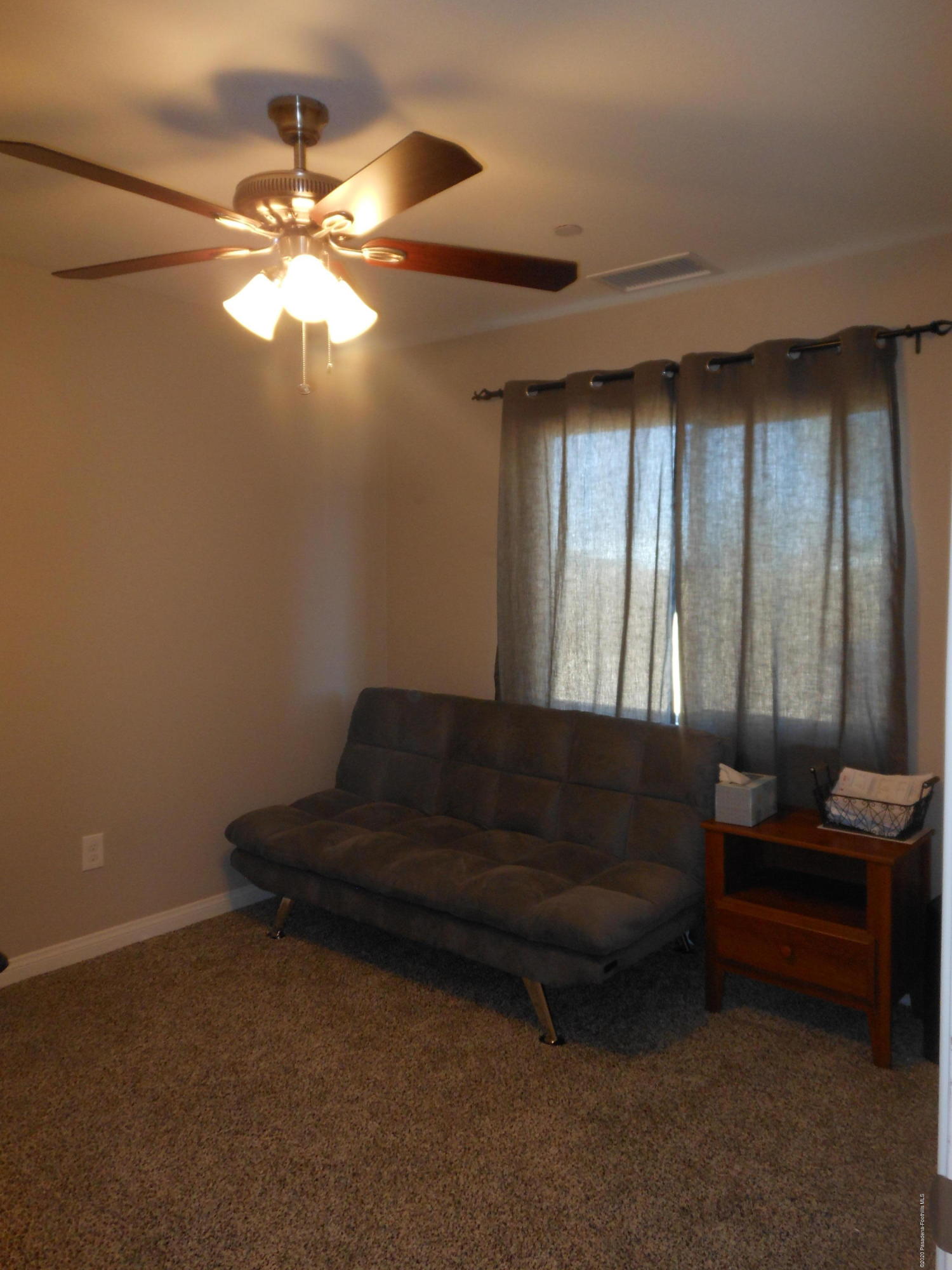 14806 Cheyenne Road Apple Valley, CA 92307 - Photo 13 of 15 a living room with furniture and a chandelier