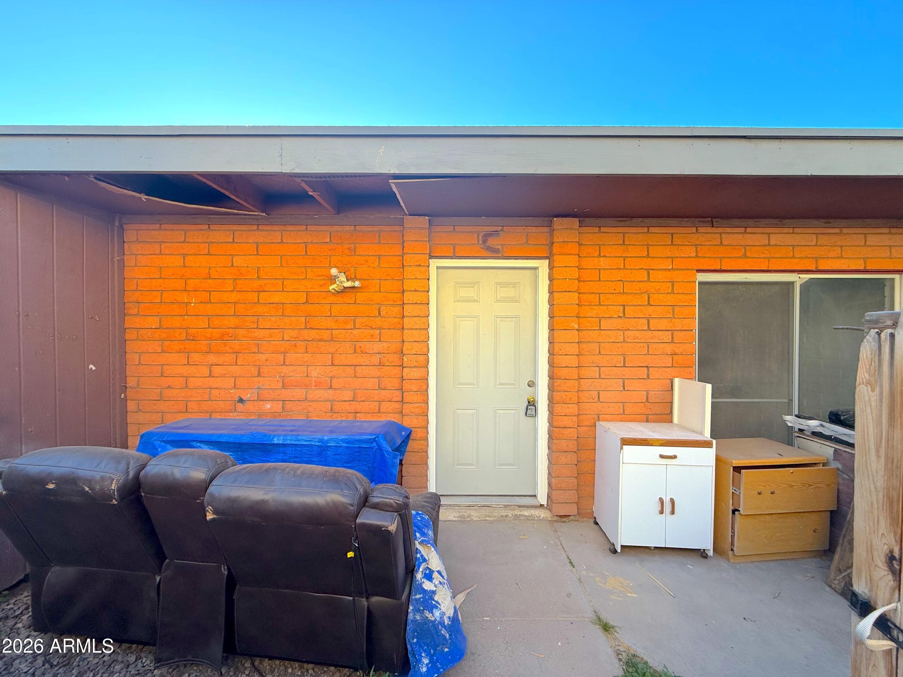 433 West Ray Road, Unit C Chandler, AZ 85225 - Photo 2 of 7 a bedroom with a bed and a window