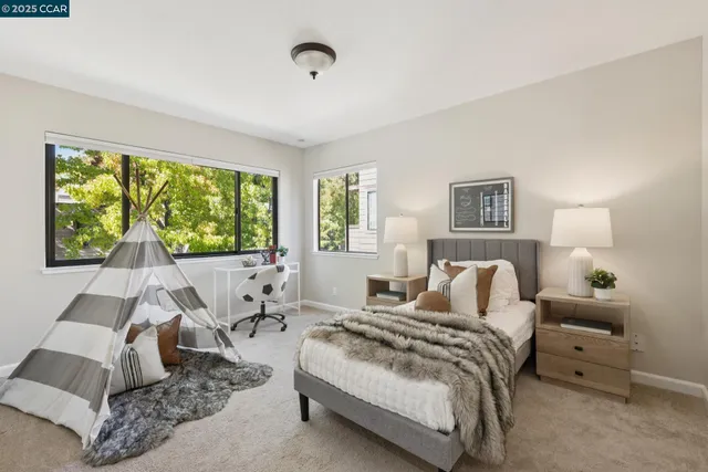 a bedroom with a bed and a couch