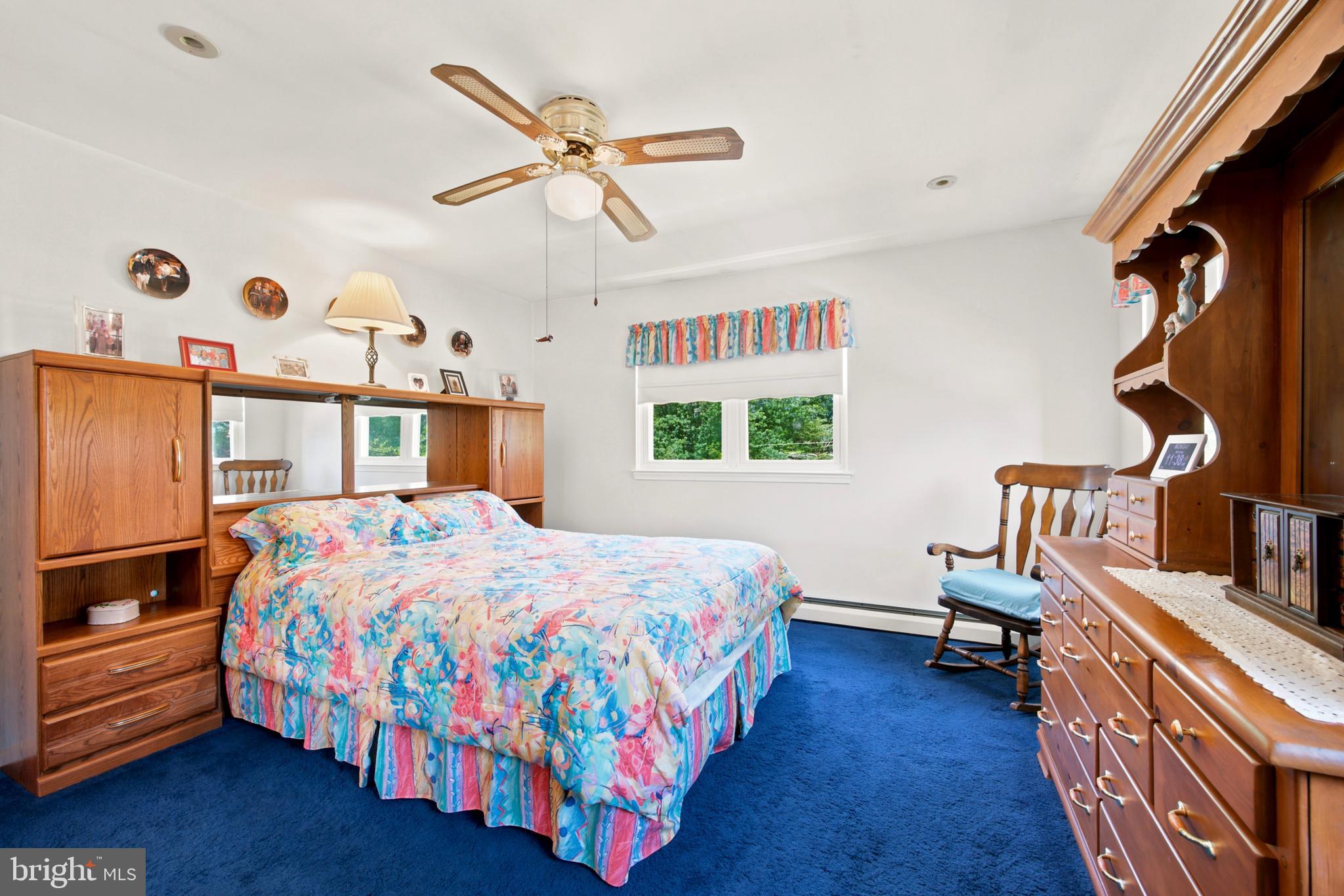 1004 Green Lane Secane, PA 19018 - Photo 23 of 49 a bedroom with a bed and wooden floor
