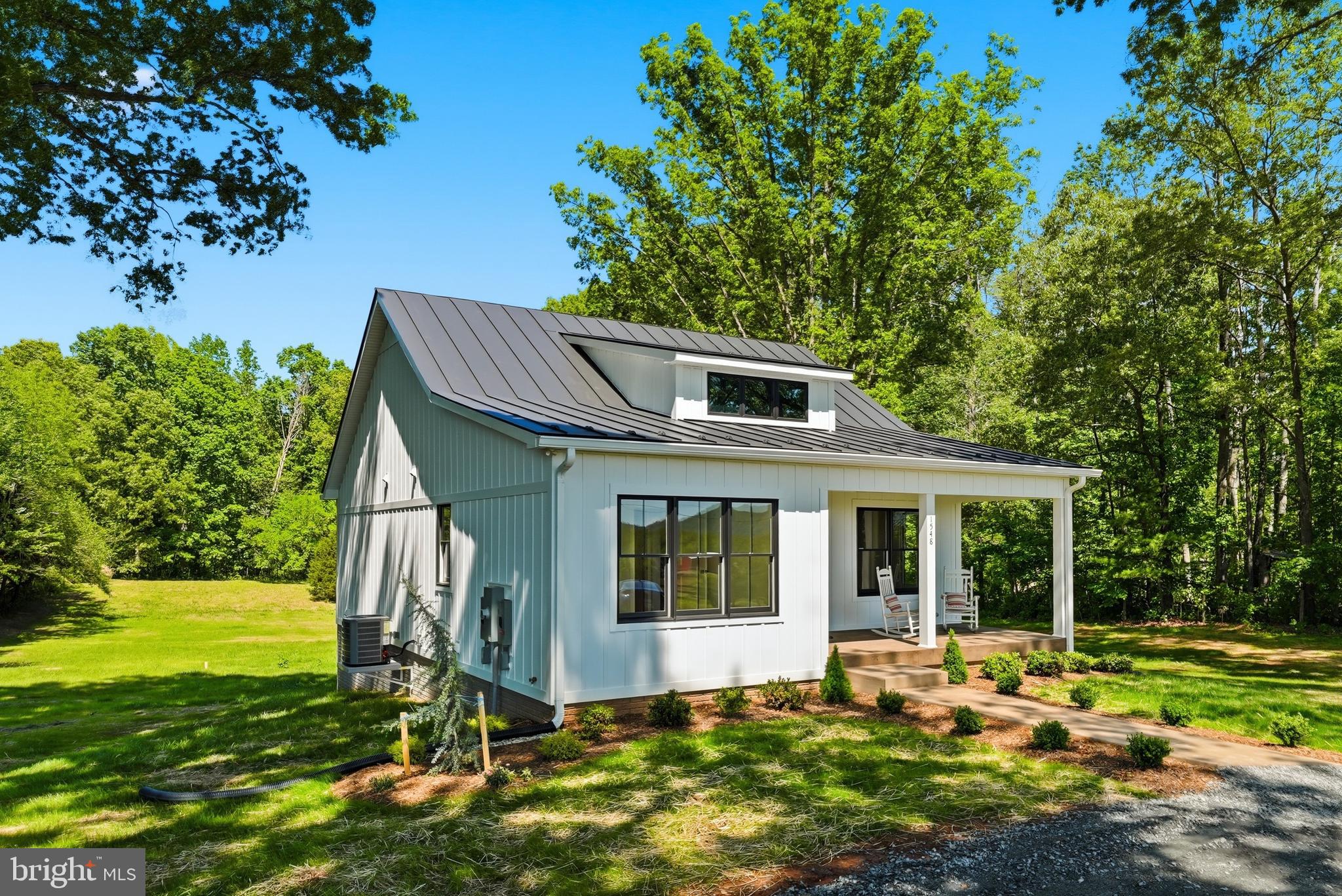 1548 James City Road Reva, VA 22735 - Photo 2 of 48 a front view of a house with garden