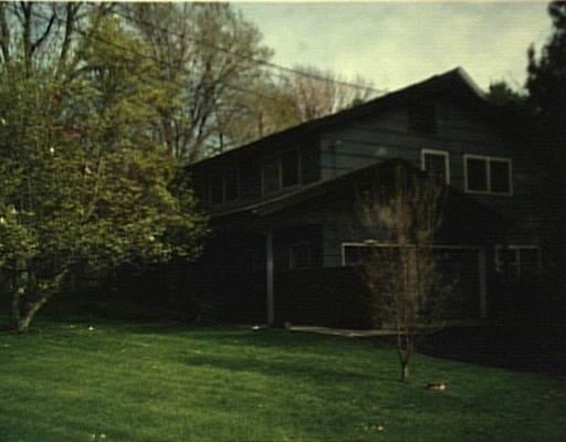 43 Continental Drive Ridgefield, CT 06877 - Photo 1 of 1 a backyard of a house with lots of green space