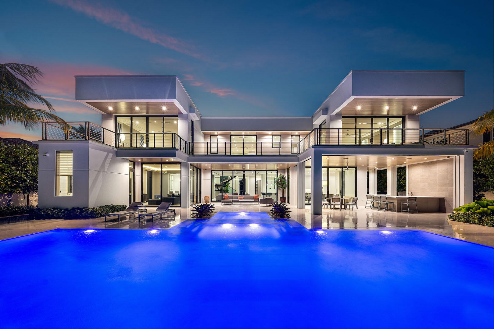 175 Alexander Palm Road Boca Raton, FL 33432 - Photo 2 of 71 a front view of a building with swimming pool and sitting space