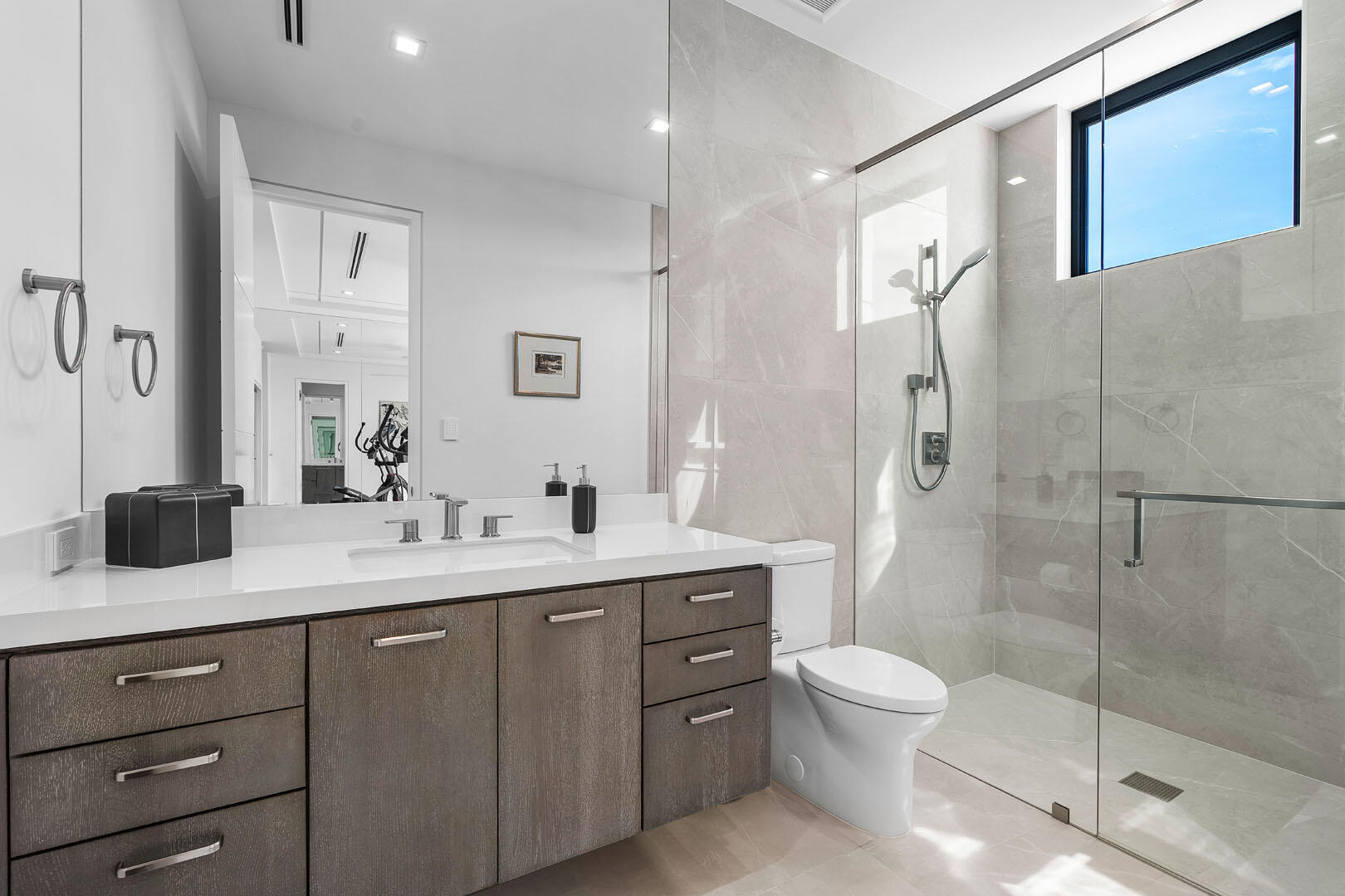 175 Alexander Palm Road Boca Raton, FL 33432 - Photo 39 of 71 a bathroom with a double vanity sink toilet mirror and shower