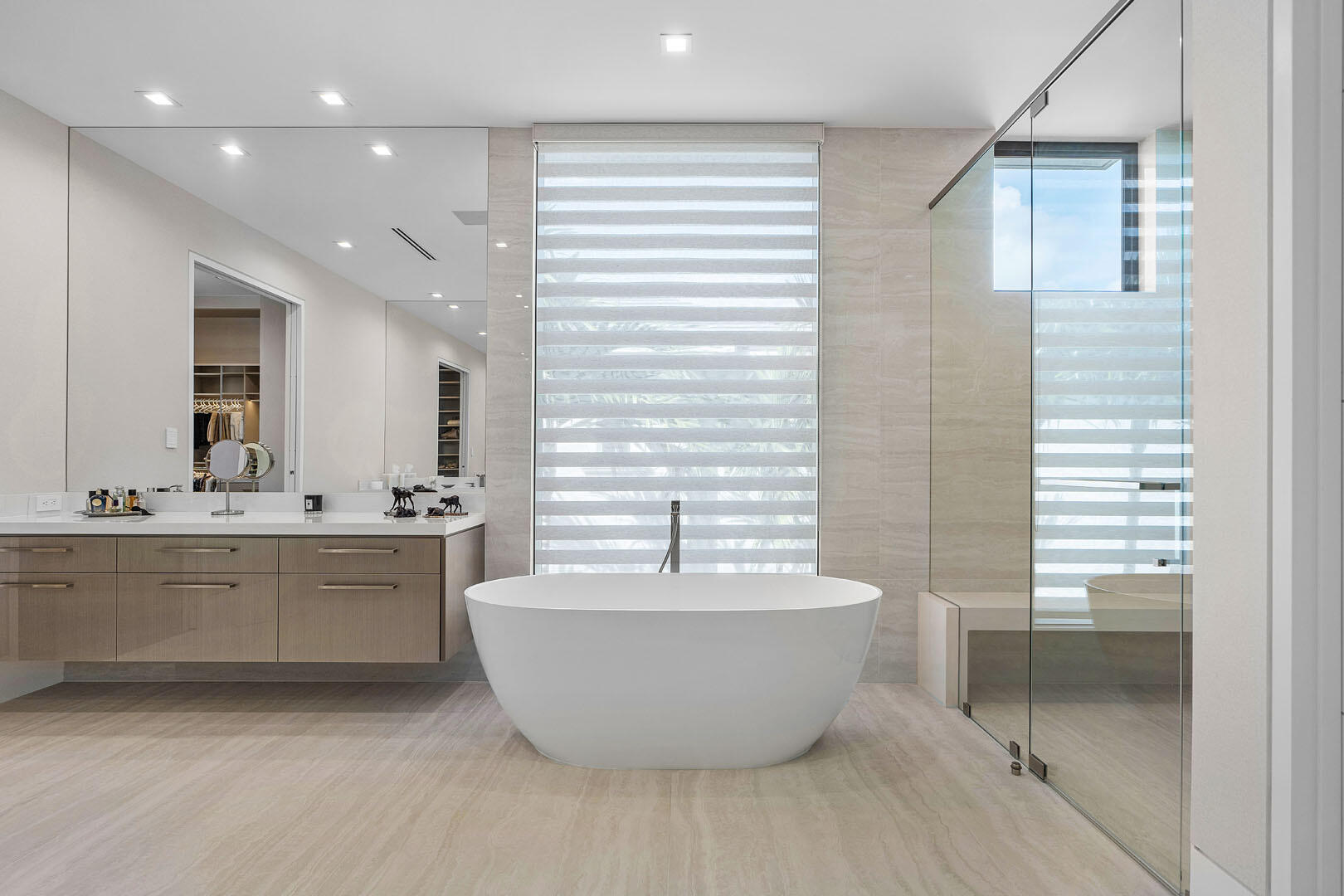 175 Alexander Palm Road Boca Raton, FL 33432 - Photo 46 of 71 a spacious bathroom with a bathtub and sink