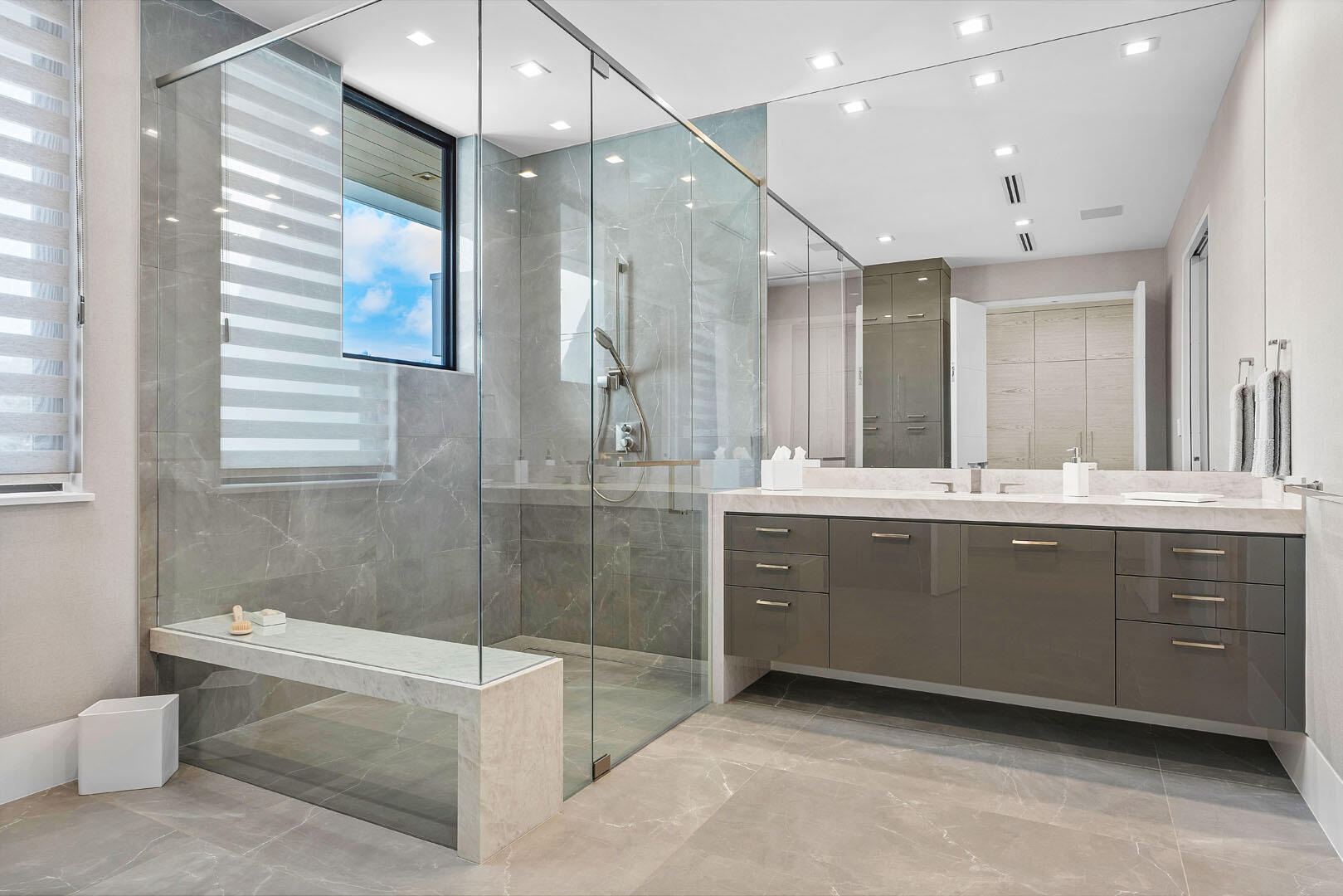 175 Alexander Palm Road Boca Raton, FL 33432 - Photo 48 of 71 a bathroom with a sink a large mirror and a bathtub