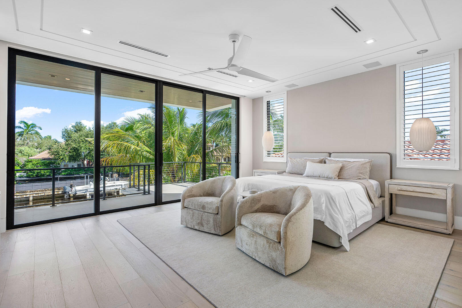 175 Alexander Palm Road Boca Raton, FL 33432 - Photo 49 of 71 a spacious bedroom with a large bed and a large window