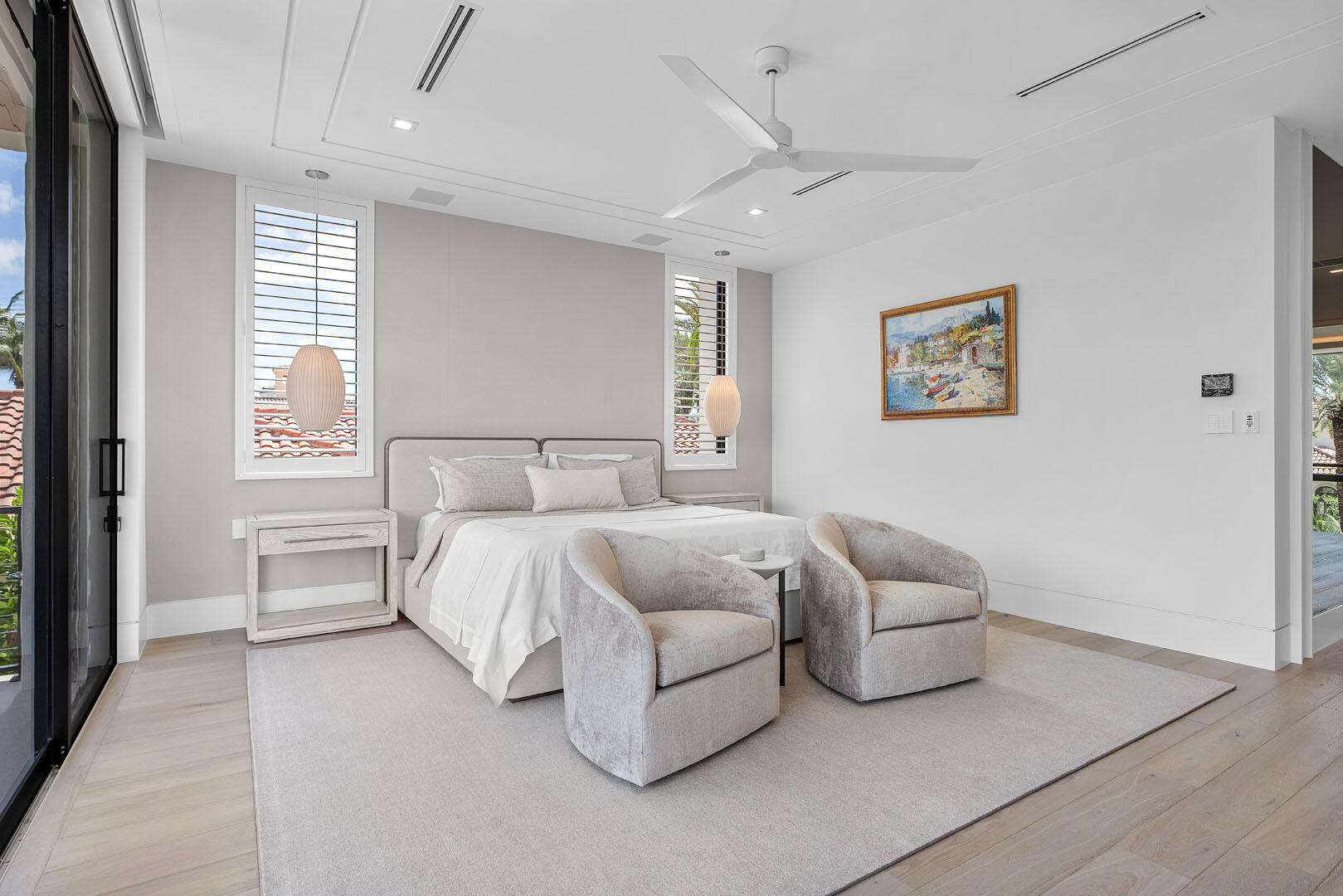 175 Alexander Palm Road Boca Raton, FL 33432 - Photo 50 of 71 a spacious bedroom with a bed and a couch