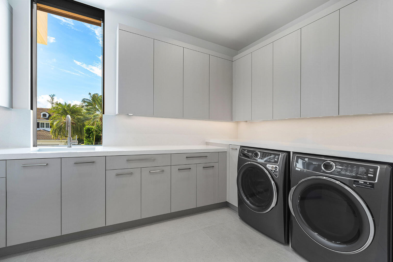 175 Alexander Palm Road Boca Raton, FL 33432 - Photo 57 of 71 a utility room with sink dryer and washer
