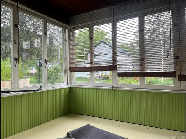 a view of a room that has a window