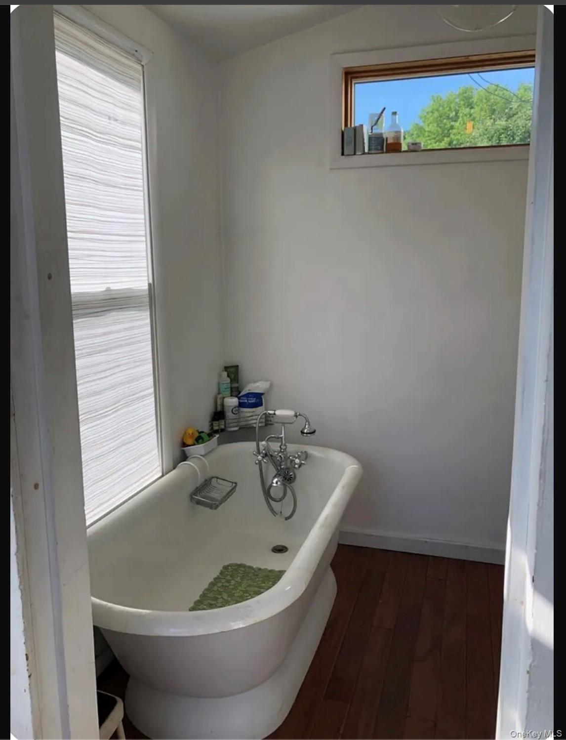 36 Middle Street East Branch, NY 13756 - Photo 7 of 15 a white bath tub sitting next to a window