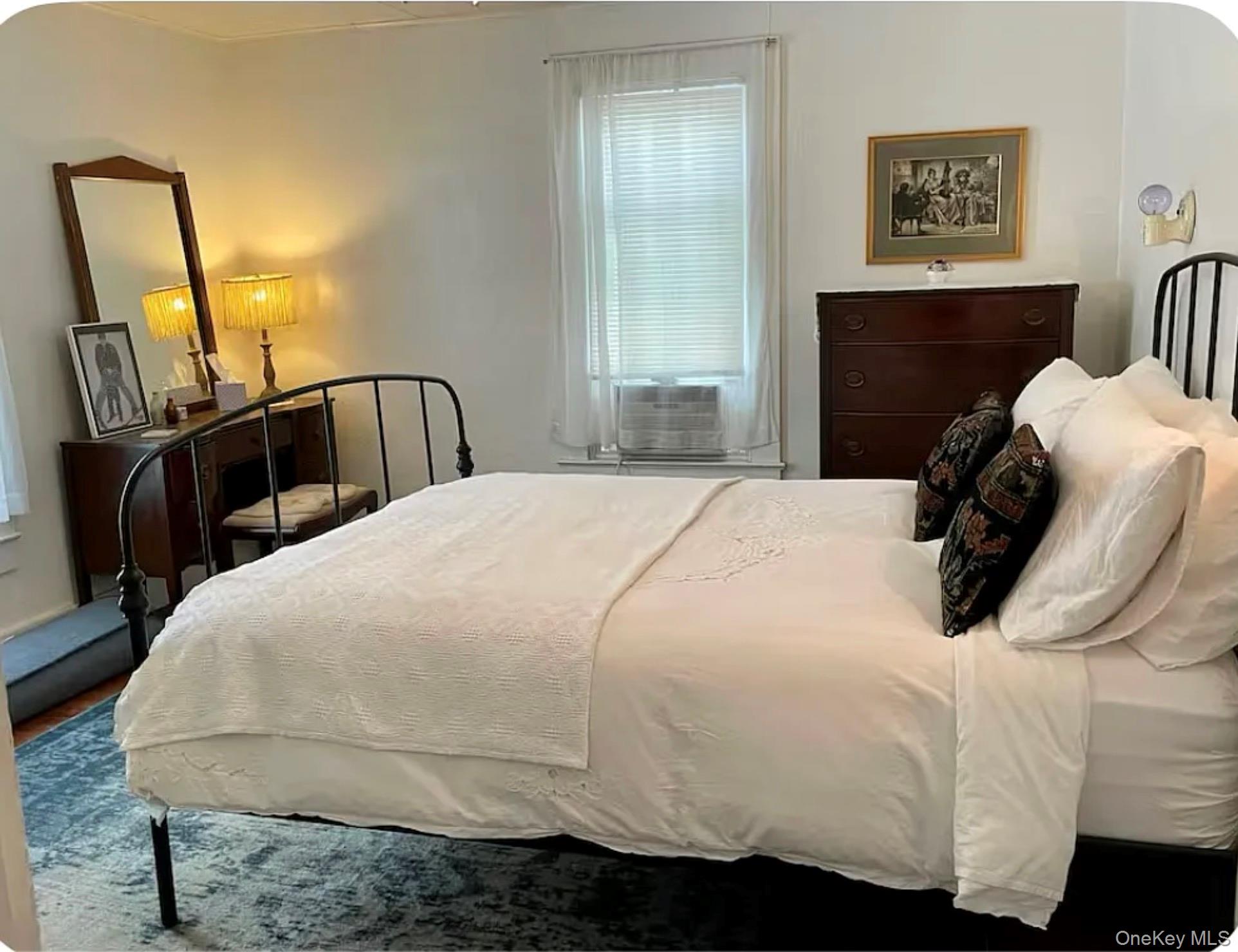 36 Middle Street East Branch, NY 13756 - Photo 9 of 15 a bedroom with a bed and wooden floor