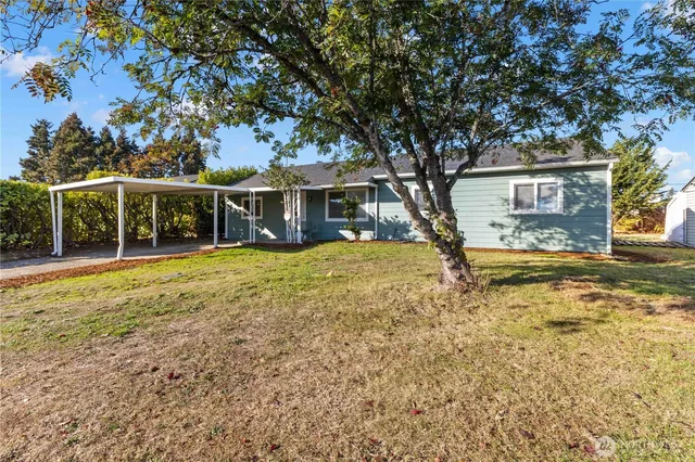 front view of a house with a yard
