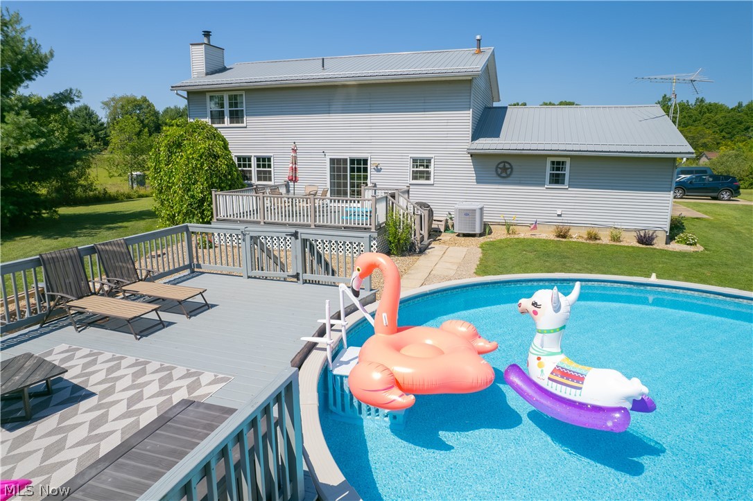 3856 Jones Road Diamond, OH 44412 - Photo 9 of 38 View of swimming pool with a wooden deck