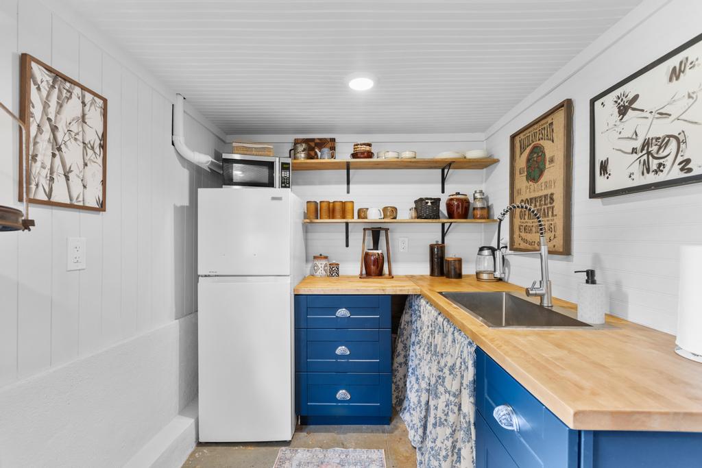20 Alae Street Hilo, HI 96720 - Photo 22 of 30 a kitchen with a refrigerator and a sink
