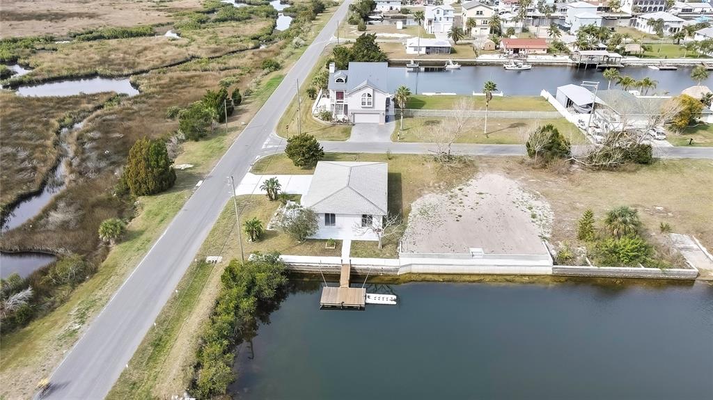 3449 Companero Entra Hernando Beach, FL 34607 - Photo 24 of 31 an aerial view of a house with a lake view