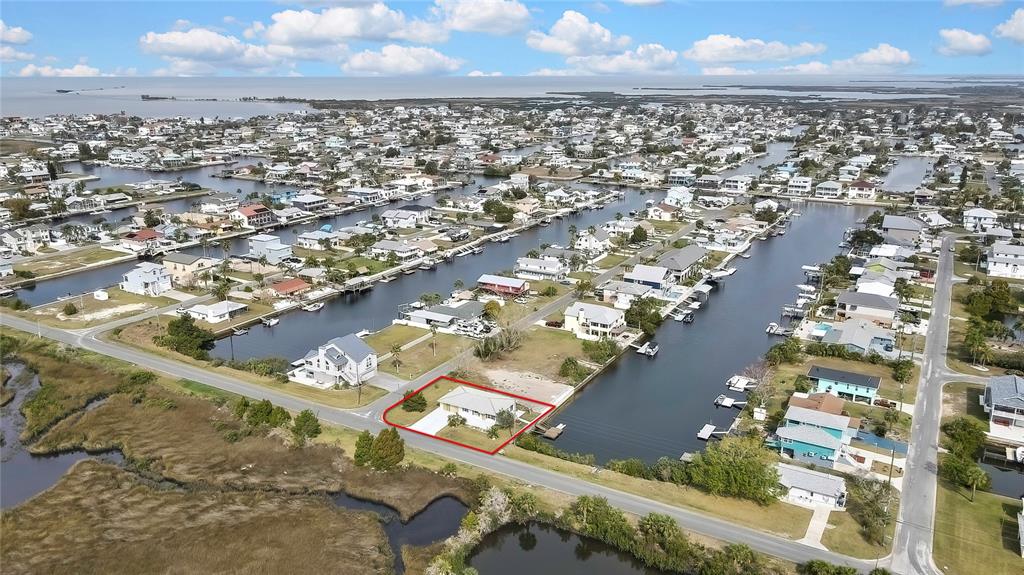 3449 Companero Entra Hernando Beach, FL 34607 - Photo 28 of 31 an aerial view of residential building and car parked