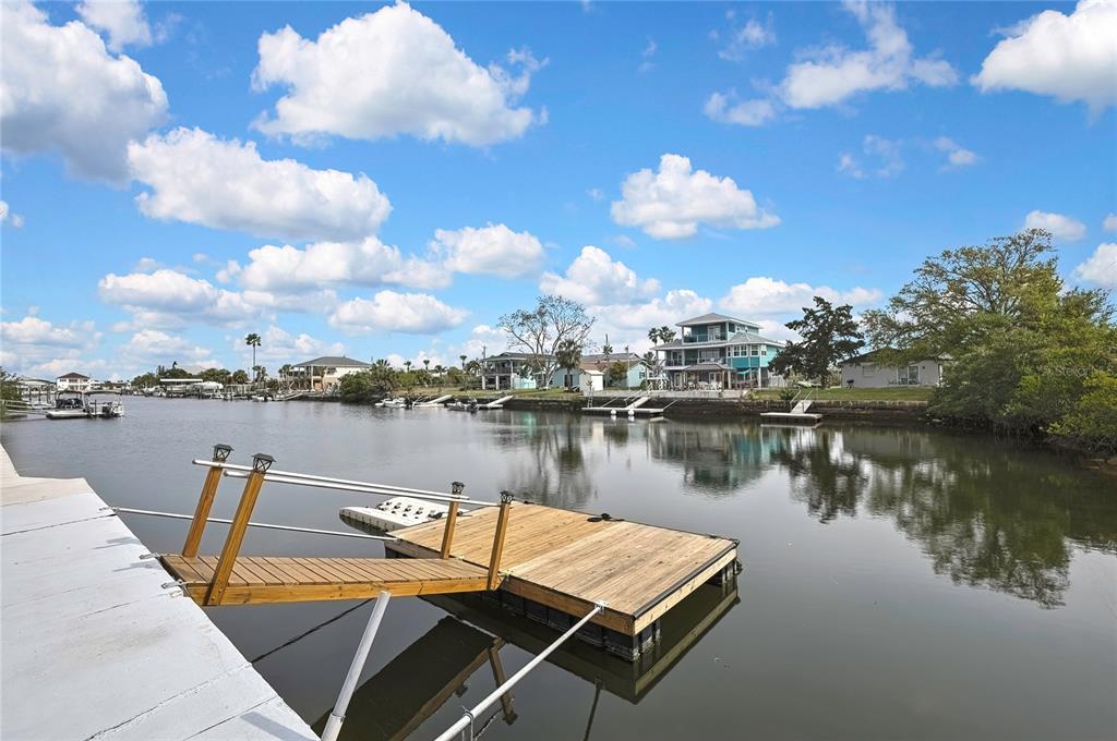 3449 Companero Entra Hernando Beach, FL 34607 - Photo 10 of 31 a view of a lake with couches chairs