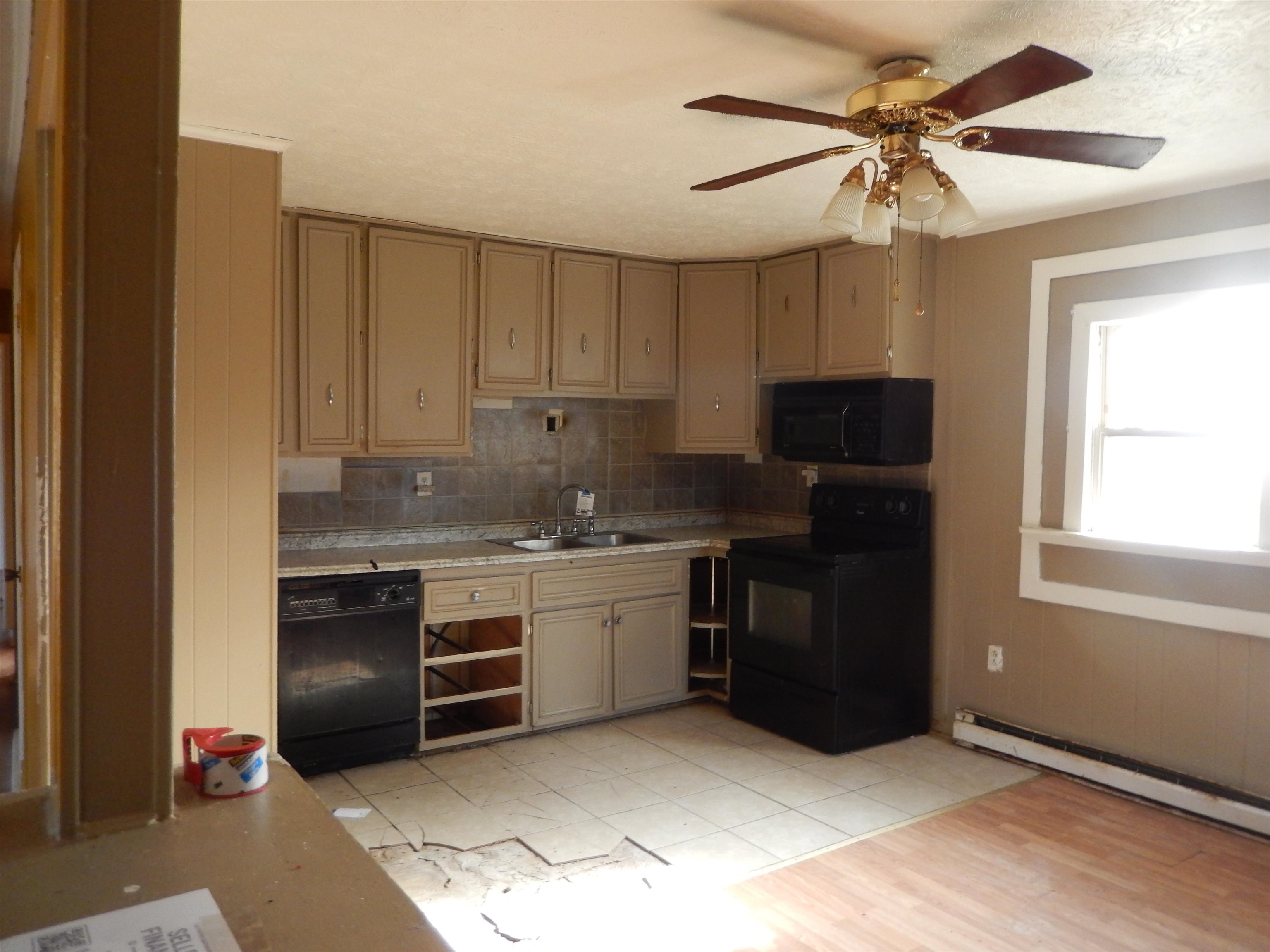 852 Augusta Farms Road Waynesboro, VA 22980 - Photo 11 of 22 a kitchen with a stove a sink and a refrigerator