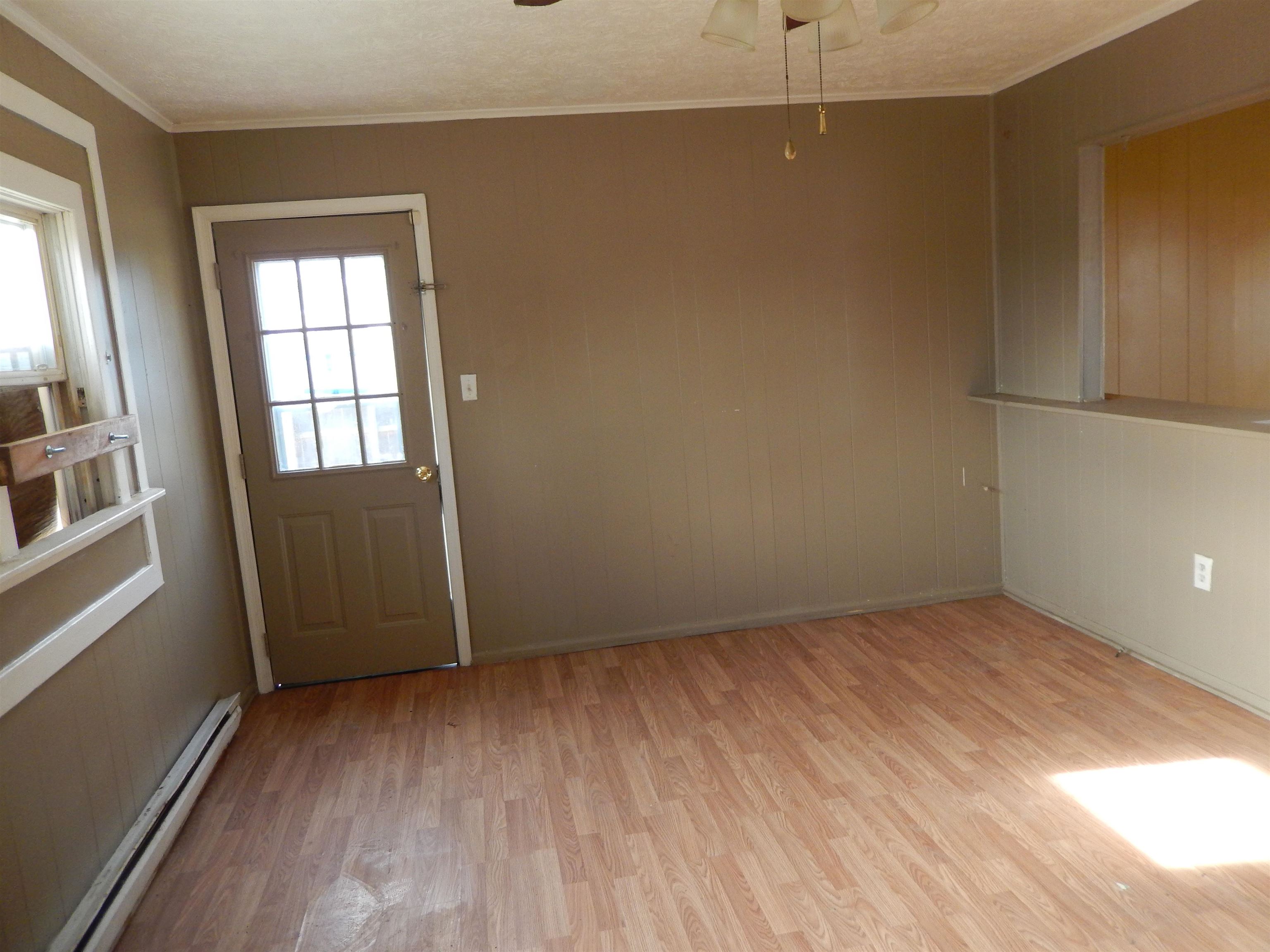 852 Augusta Farms Road Waynesboro, VA 22980 - Photo 13 of 22 an empty room with wooden floor and windows