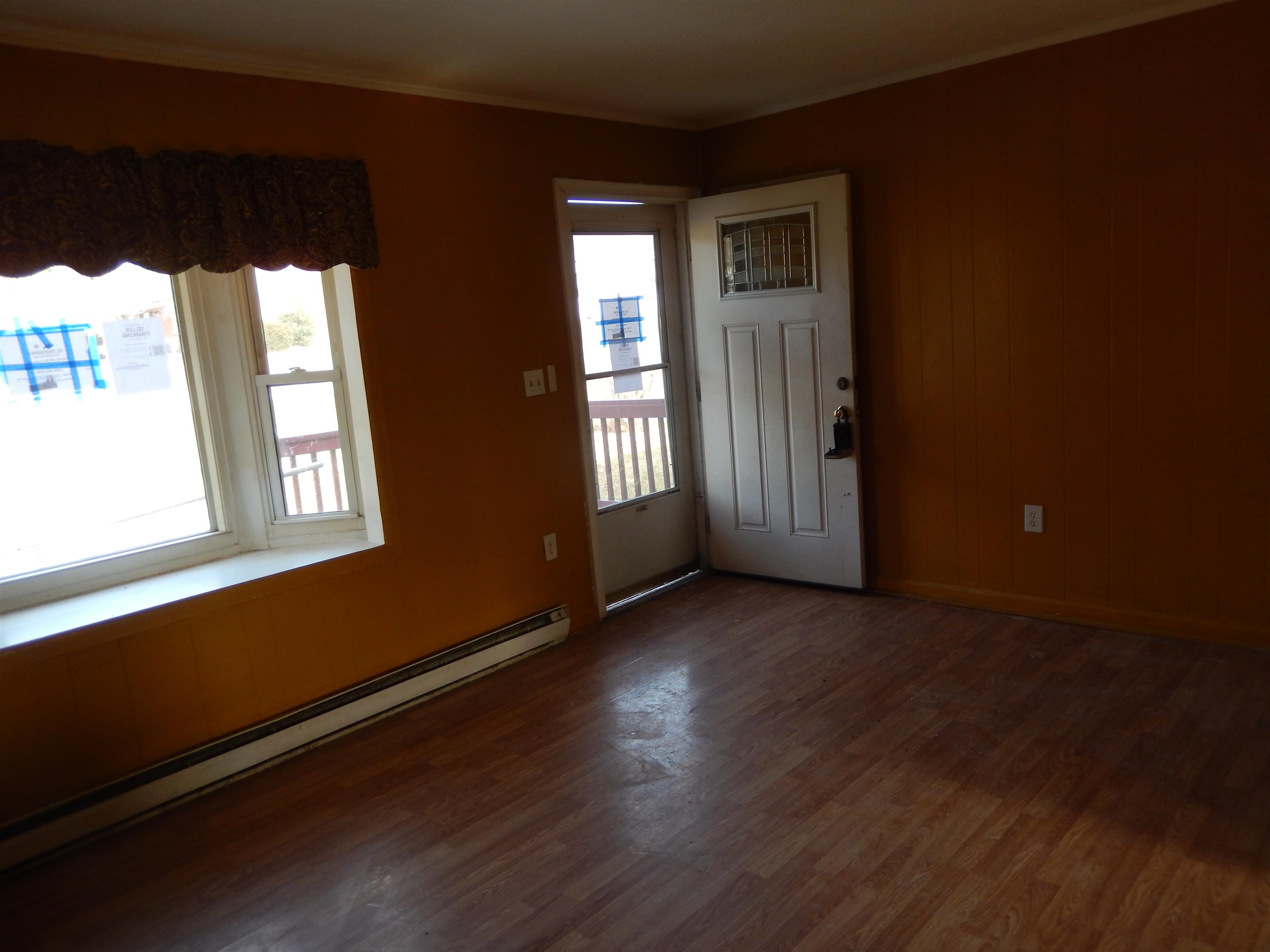 852 Augusta Farms Road Waynesboro, VA 22980 - Photo 8 of 22 an empty room with wooden floor and windows