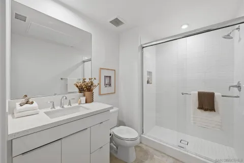 a kitchen with stainless steel appliances white cabinets and stove