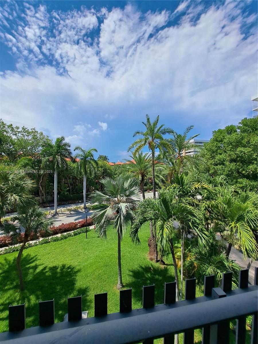 100 Ocean Ln Drive, Unit 403 Key Biscayne, FL 33149 - Photo 11 of 27 a view of a yard with plants and large trees