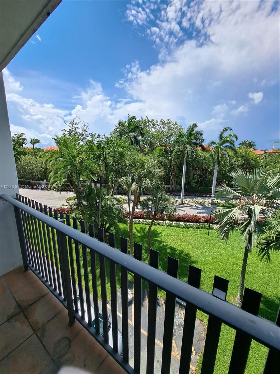 100 Ocean Ln Drive, Unit 403 Key Biscayne, FL 33149 - Photo 12 of 27 a view of a garden and deck