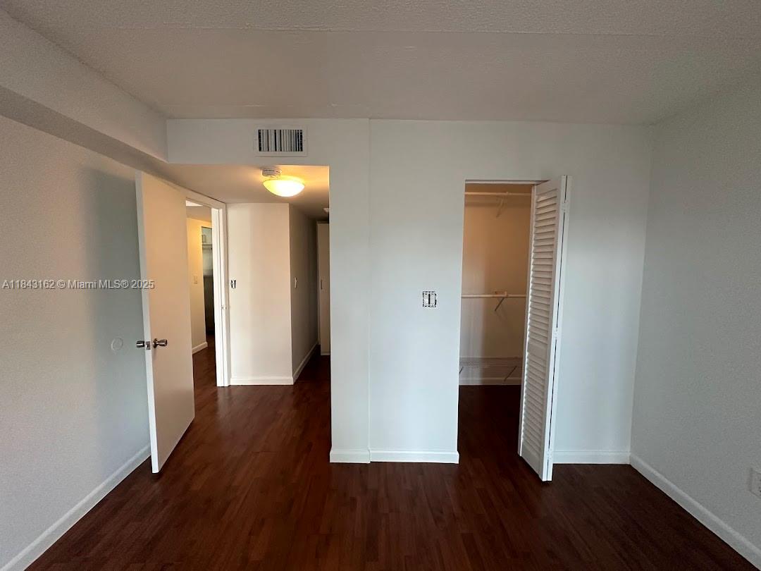 100 Ocean Ln Drive, Unit 403 Key Biscayne, FL 33149 - Photo 17 of 27 wooden floor in an empty room with a window