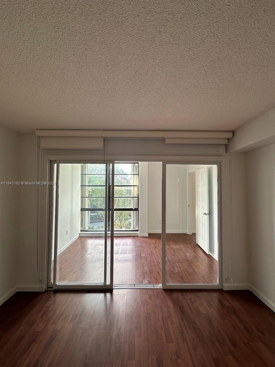 100 Ocean Ln Drive, Unit 403 Key Biscayne, FL 33149 - Photo 20 of 27 wooden floor in an empty room with a window