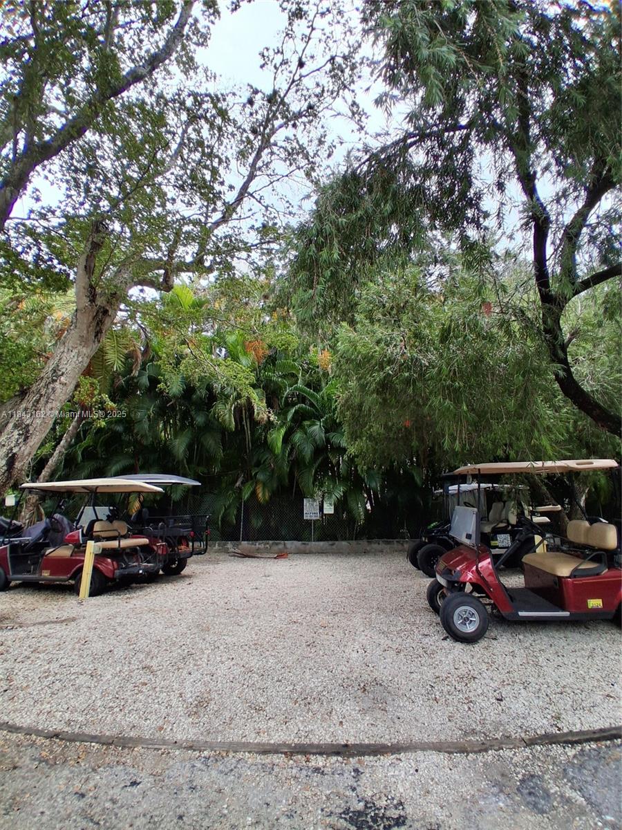 100 Ocean Ln Drive, Unit 403 Key Biscayne, FL 33149 - Photo 26 of 27 a view of a car parked in the road