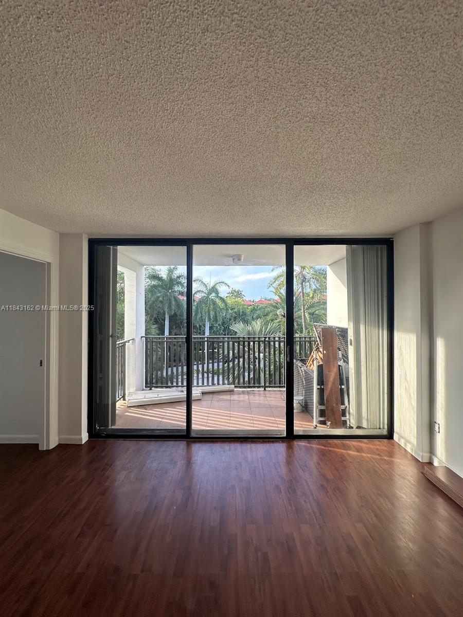 100 Ocean Ln Drive, Unit 403 Key Biscayne, FL 33149 - Photo 7 of 27 wooden floor in an empty room with a window