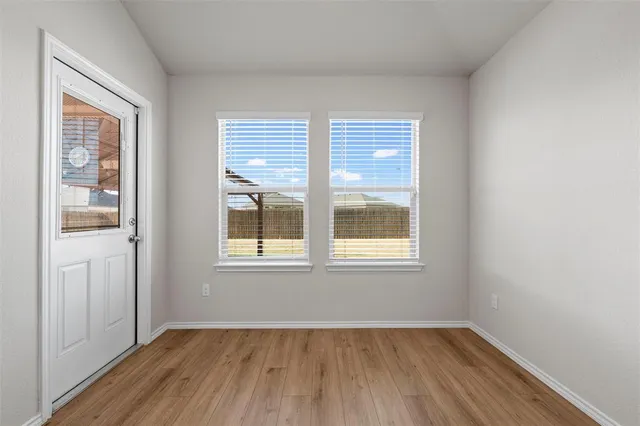 a kitchen with stainless steel appliances granite countertop a refrigerator microwave and sink