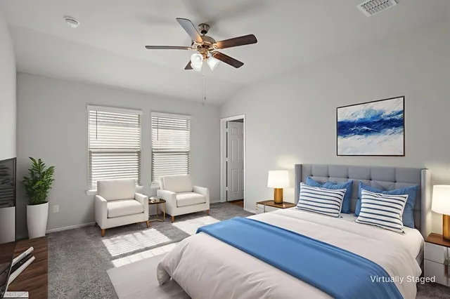 an empty room with chandelier fan