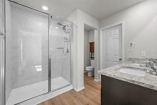 a bedroom with furniture and a large window