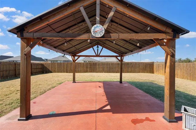 a patio with table and chairs