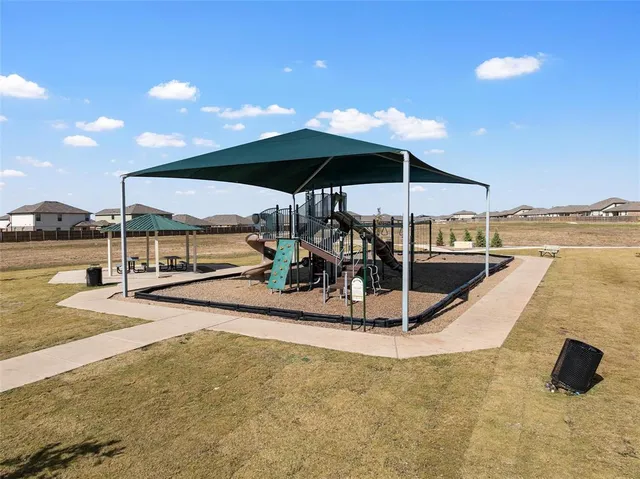 a view of a backyard of the house