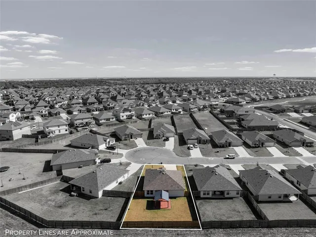 aerial view of a house with a garden